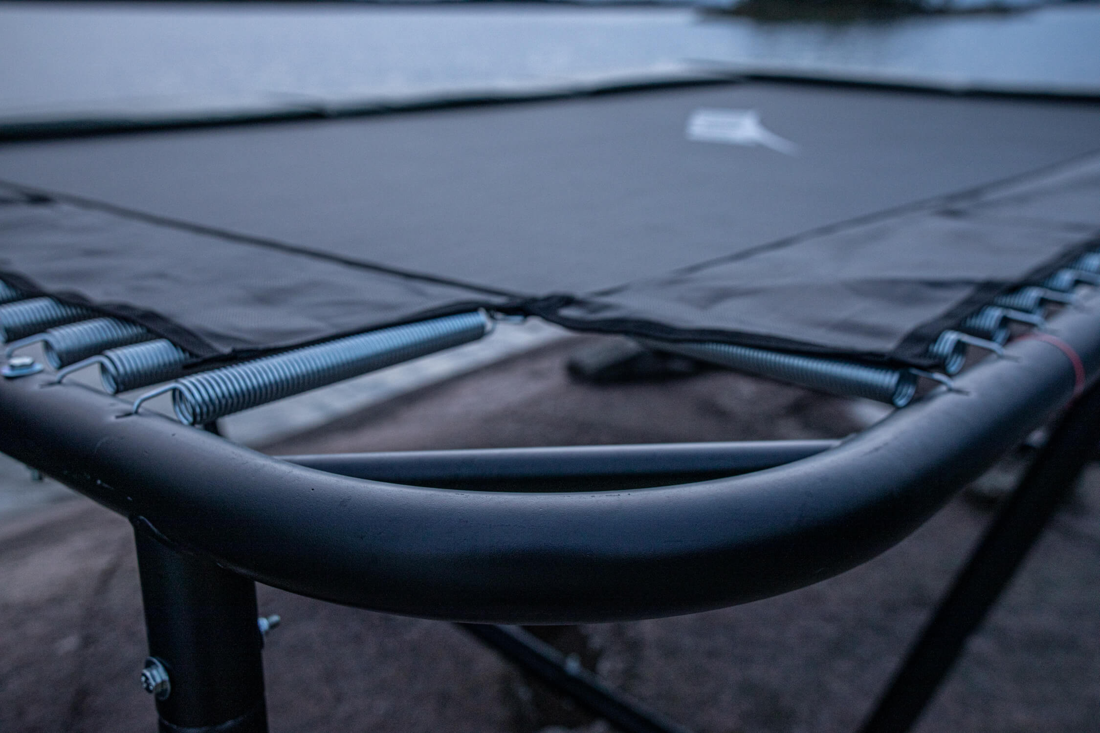 A closeup of ACON trampoline with a focus on the trampoline frame