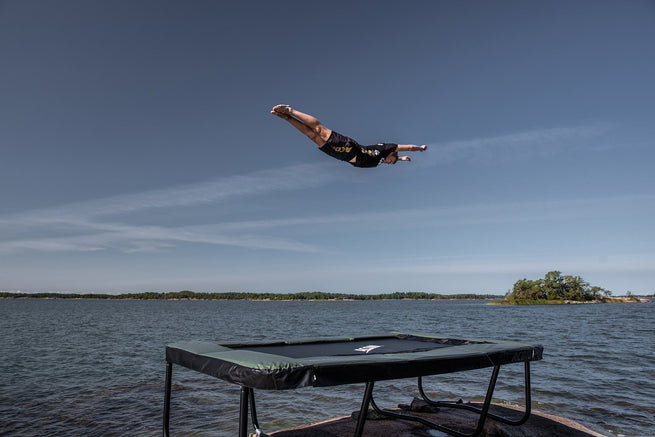 A tricker jump on Acon 13 Sport HD trampoline in an archipelago landscape