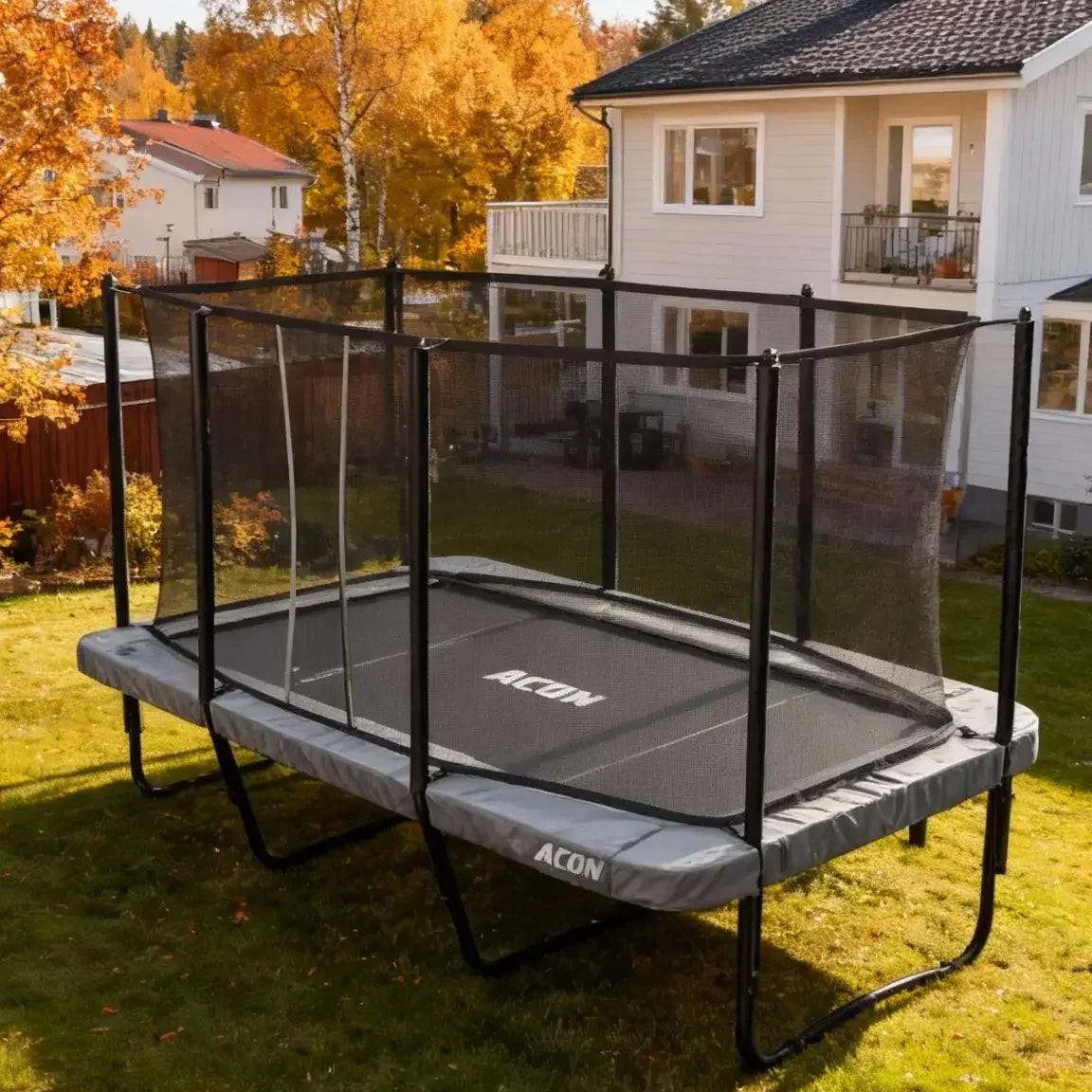 Acon HD 16 trampoline outdoors in a backyard in nice and cozy autumn weather.