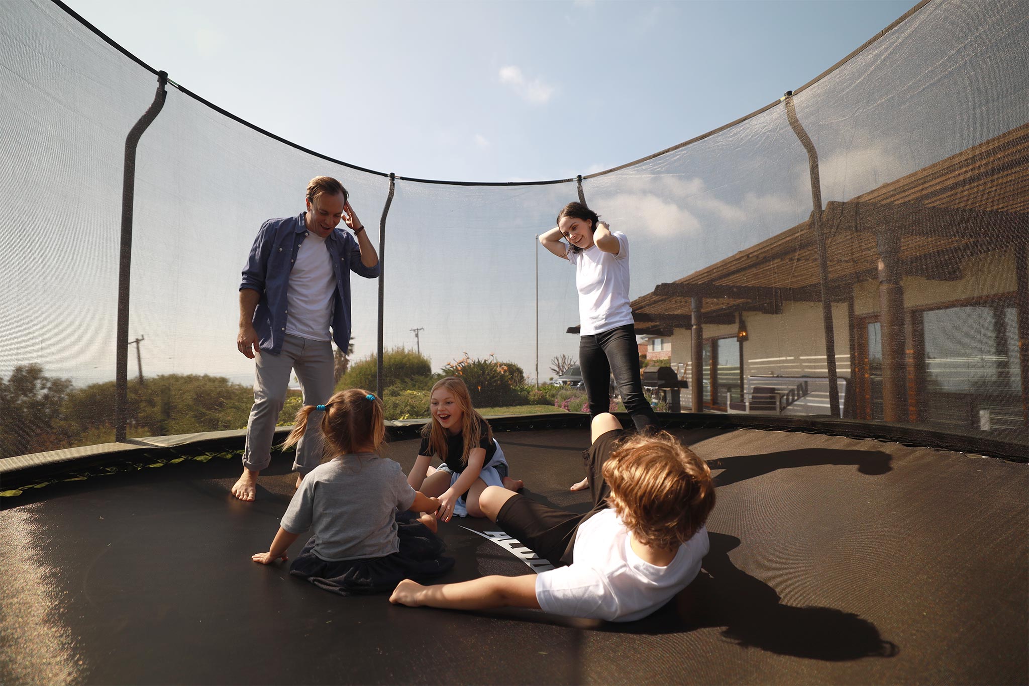 Family having fun together on a trampoline
