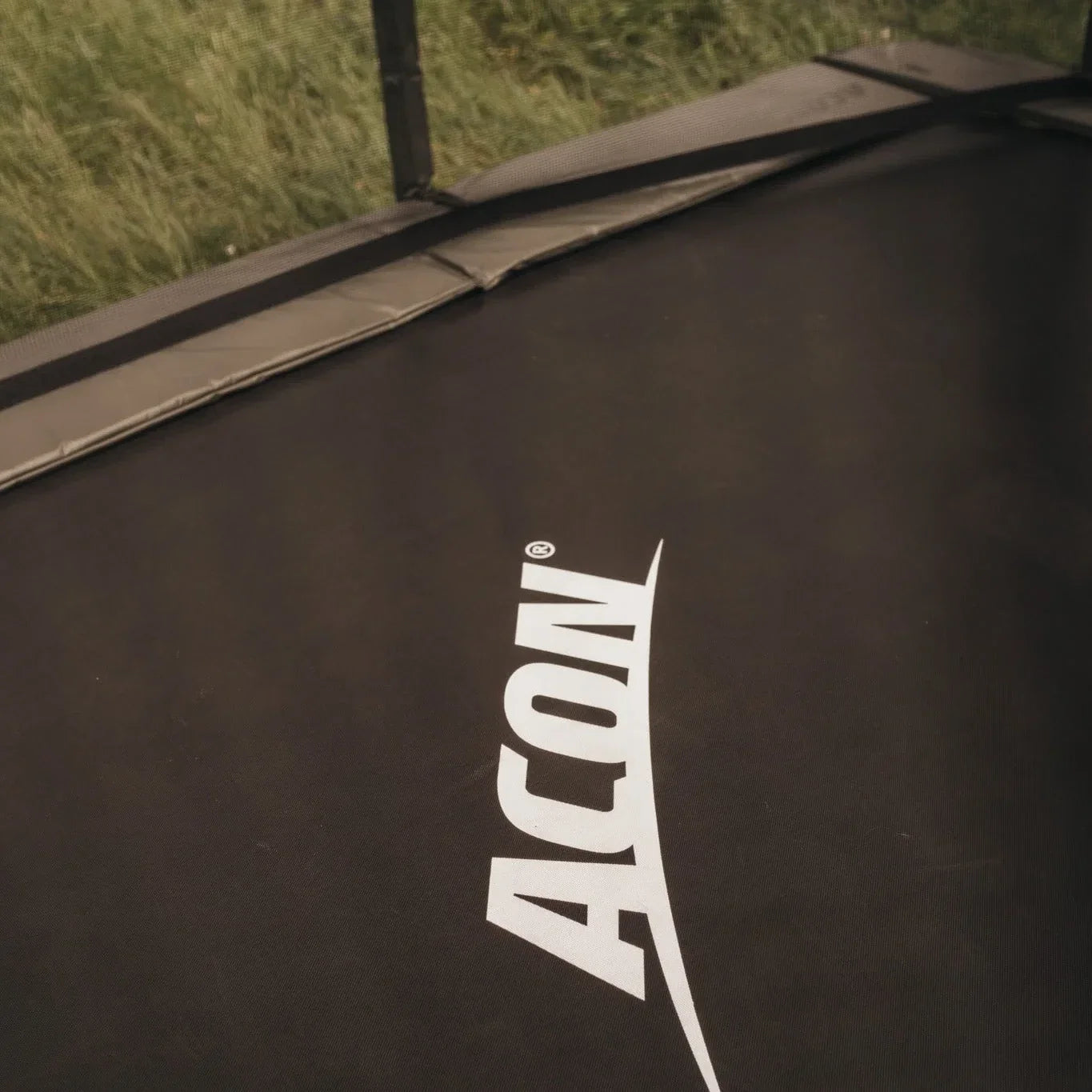 Closeup of ACON trampoline and its black mat.