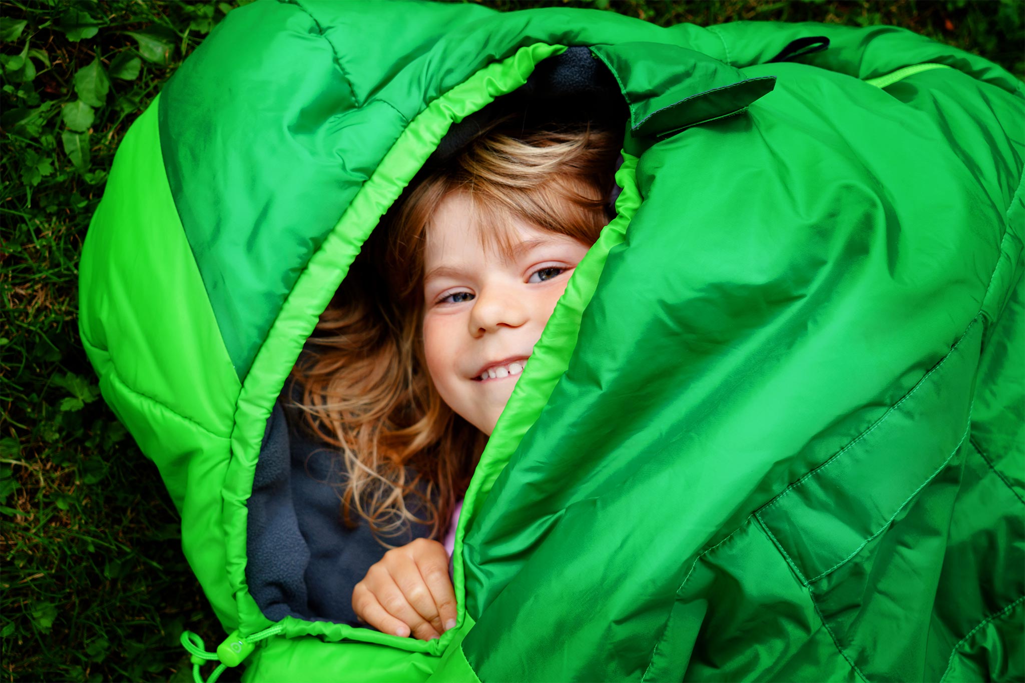 A kid in a sleeping bag
