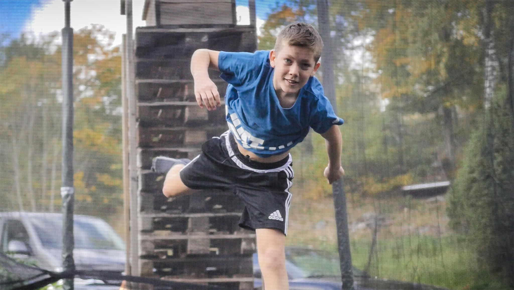 One foot trampoline jump on a garden trampoline