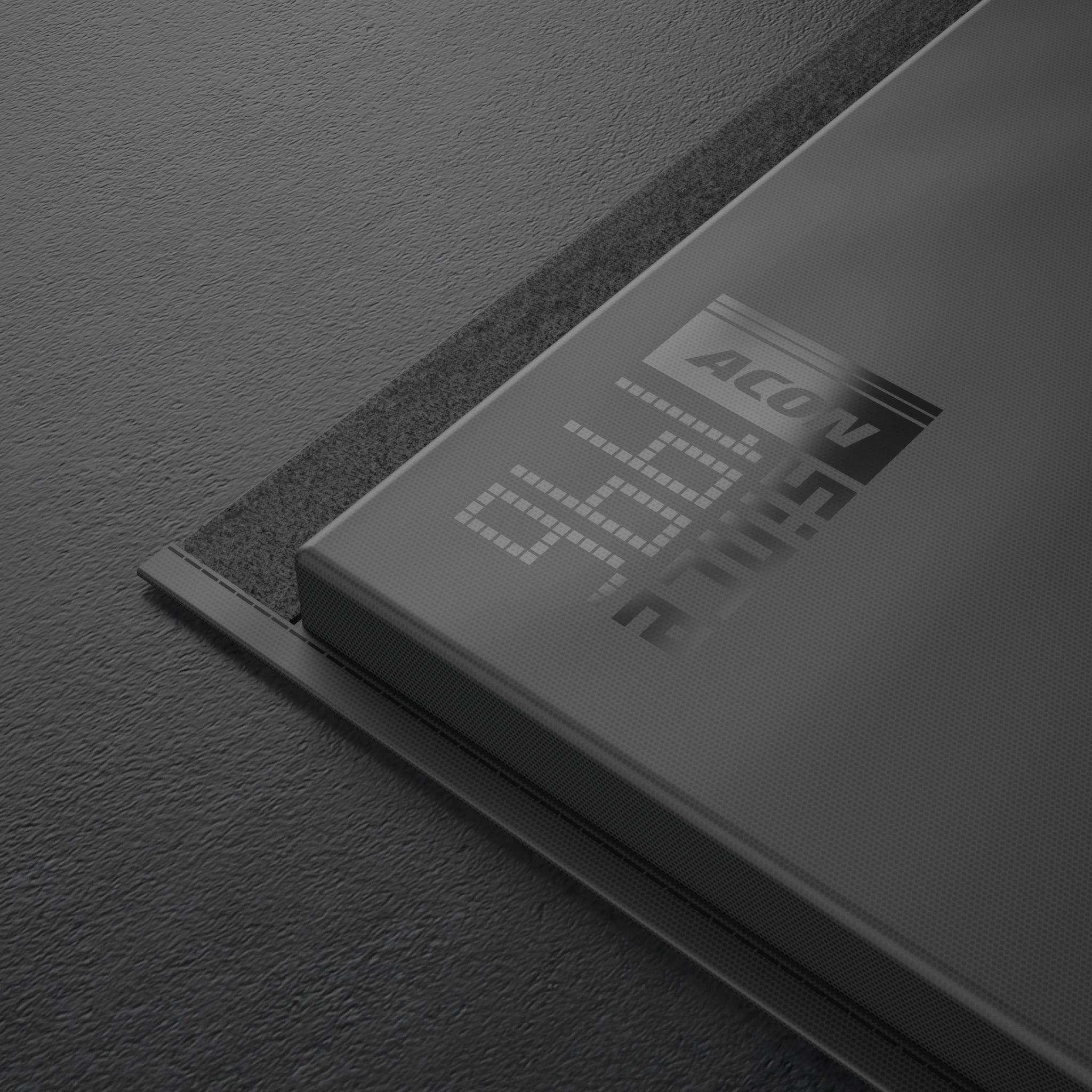 A close up of a logo in the corner of Black Edition Acon Gym Mat
