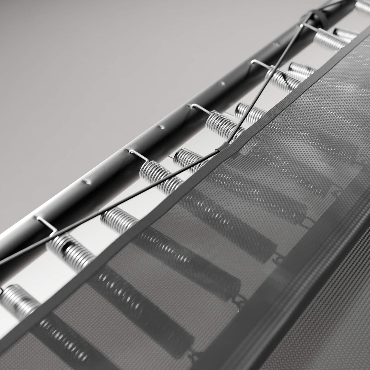 Detail of the skirt covering the springs of the Acon 13 HD trampoline and the dual-level spring adjustment.
