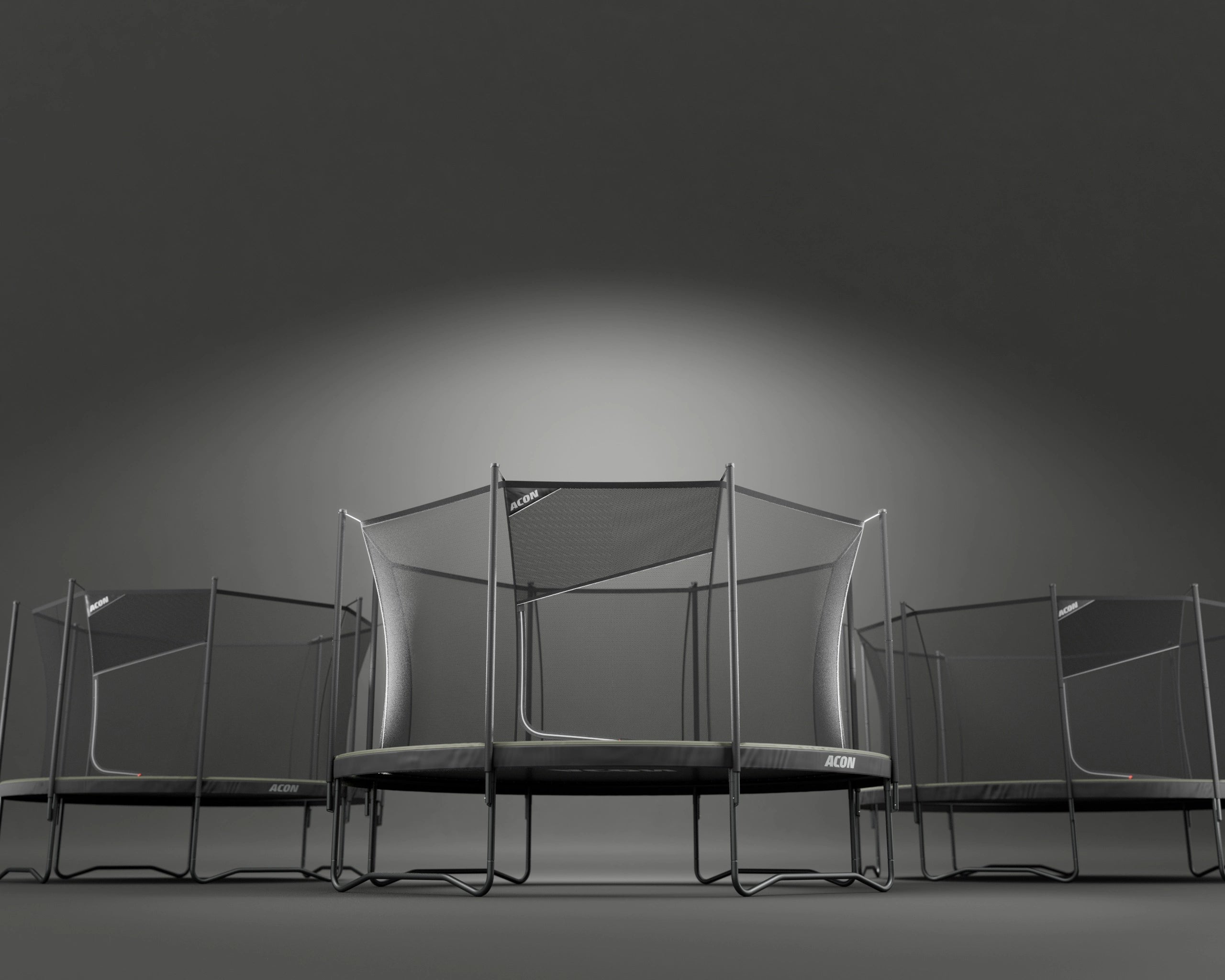 Three Acon Air trampolines on a dark background.
