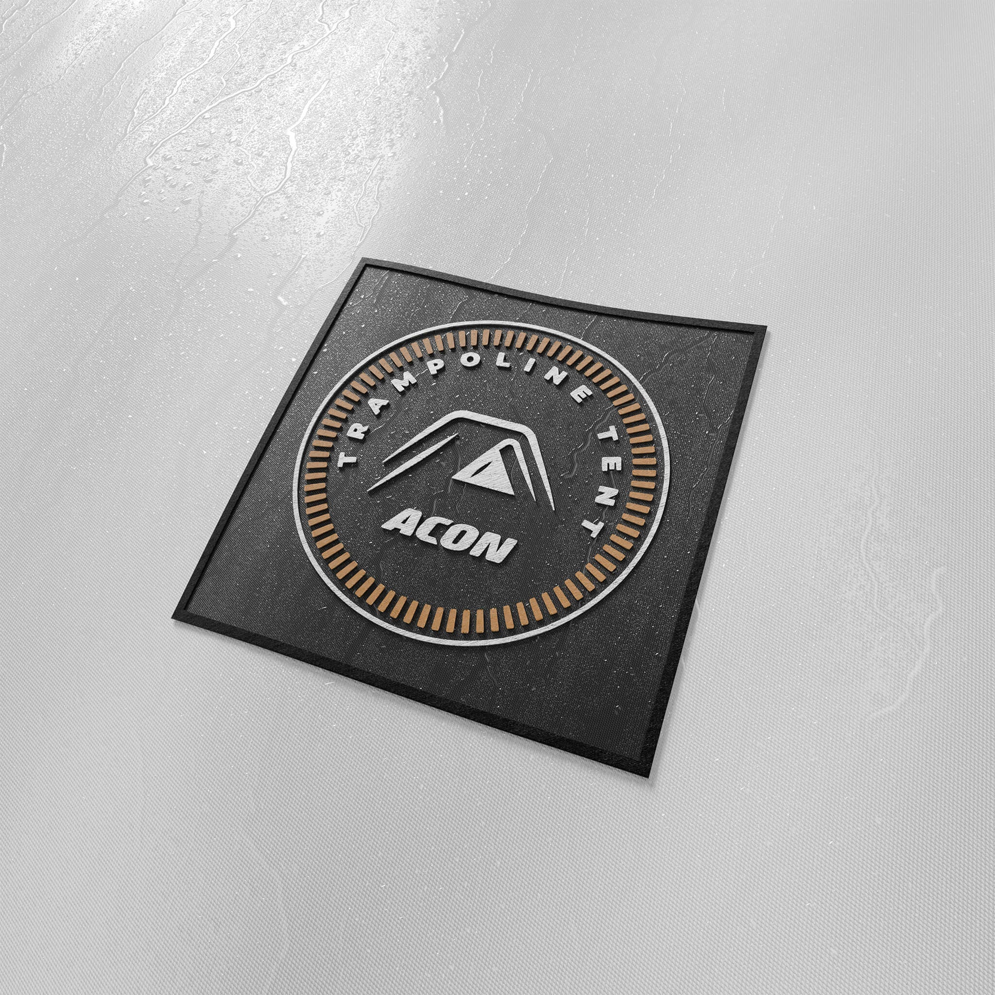 Close up image of the stitched waterproof badge onto the Acon Trampoline Tent with logo and tent illustration.