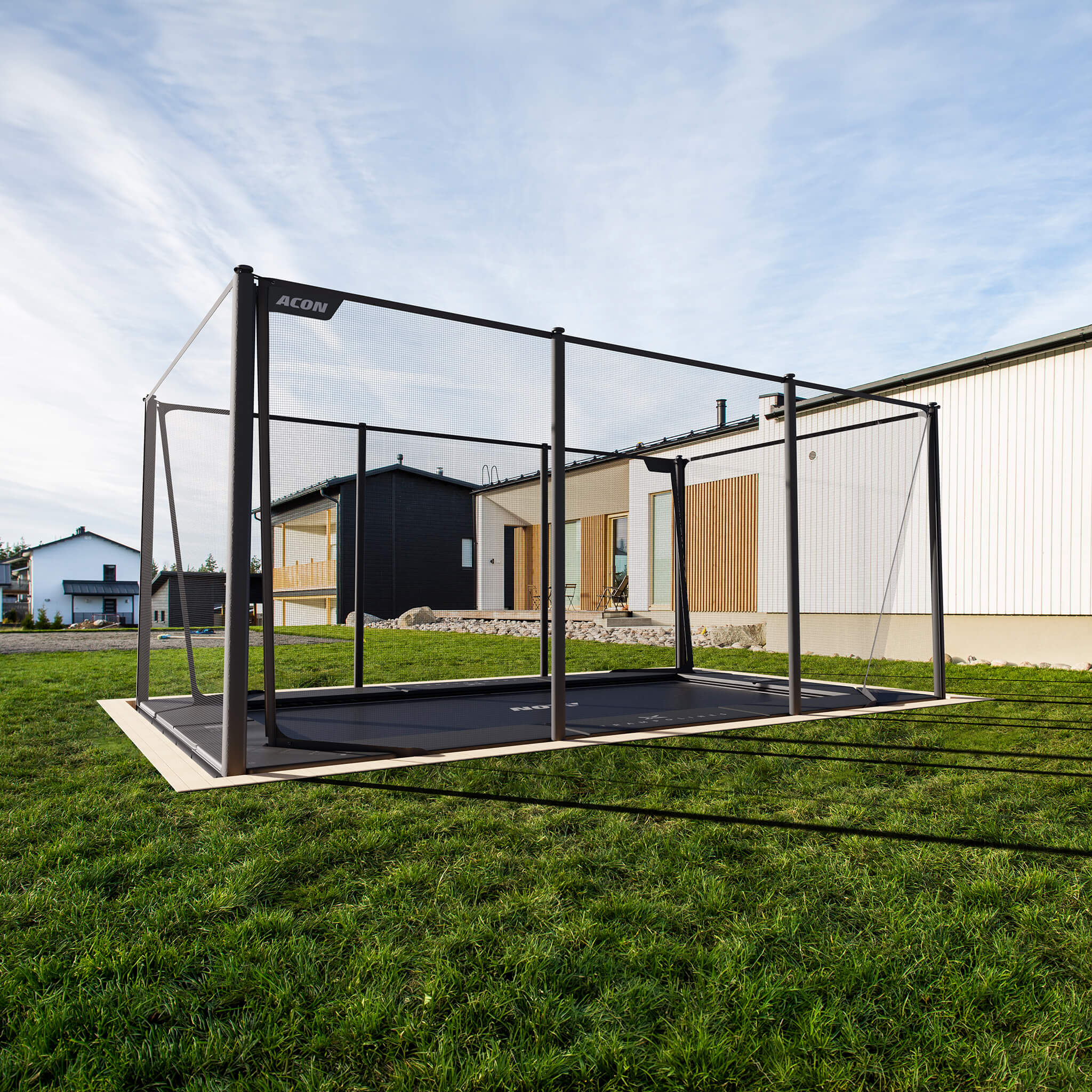 Acon X Trampoline installed in the ground in the backyard.