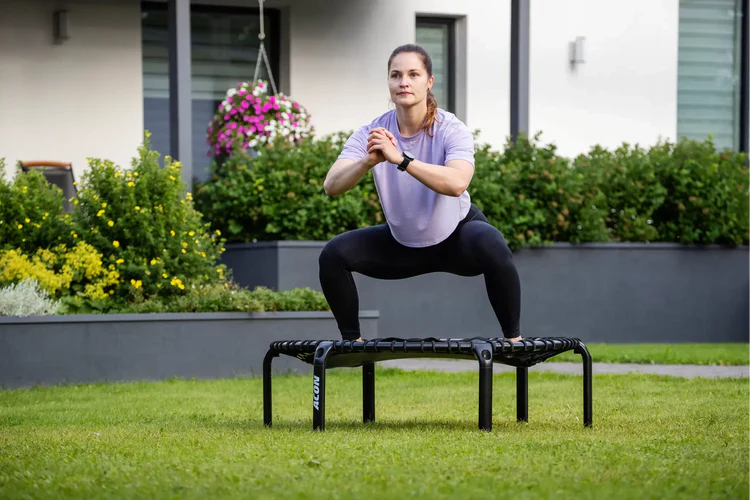 Woman exercising on an Acon rebounder.