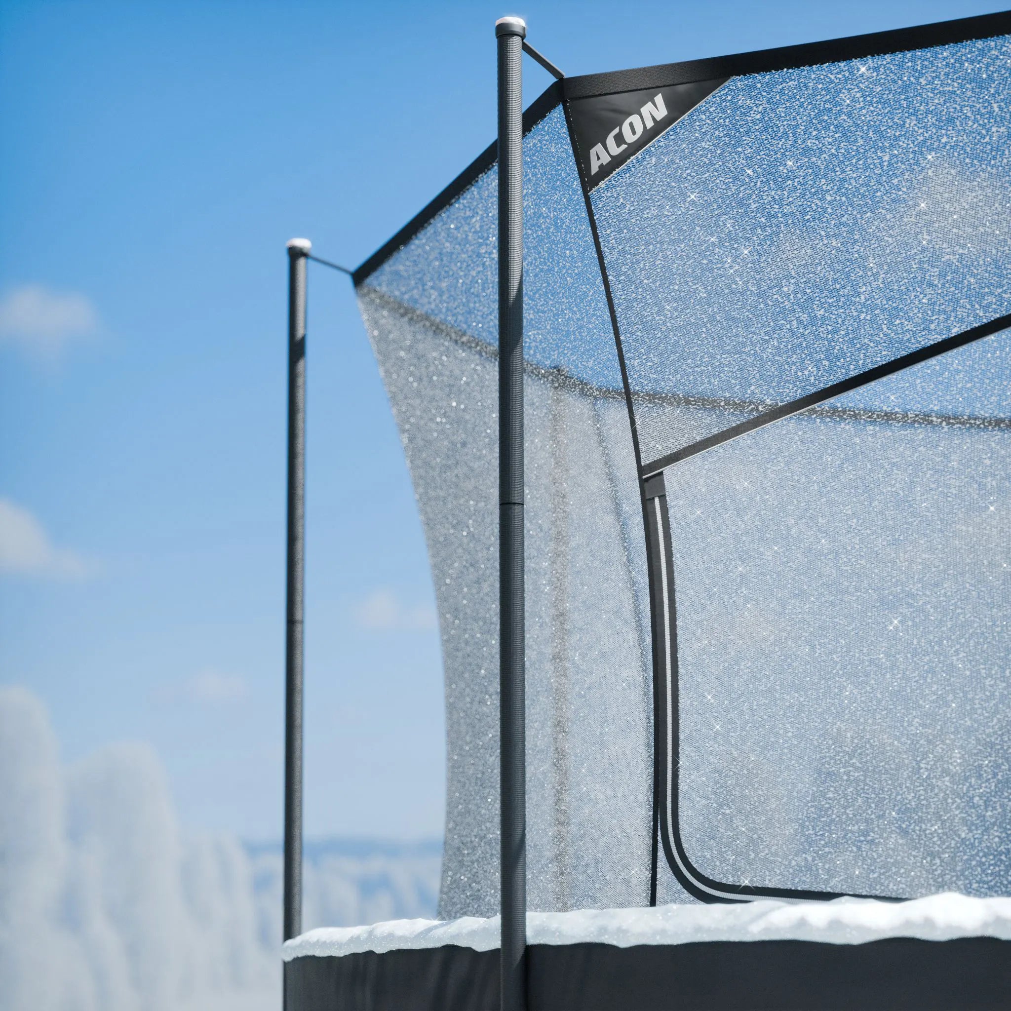 Close-up of the Acon 14ft trampoline safety net in a snowy winter setting, showing durable enclosure materials used in high‑quality 14ft trampolines.