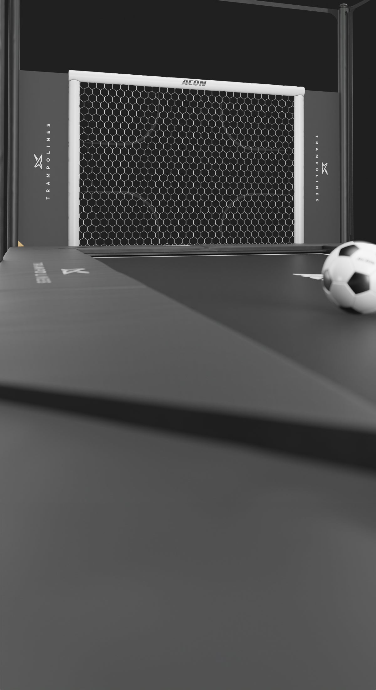 Trampoline Soccer Goal with a soccer ball on a black surface.