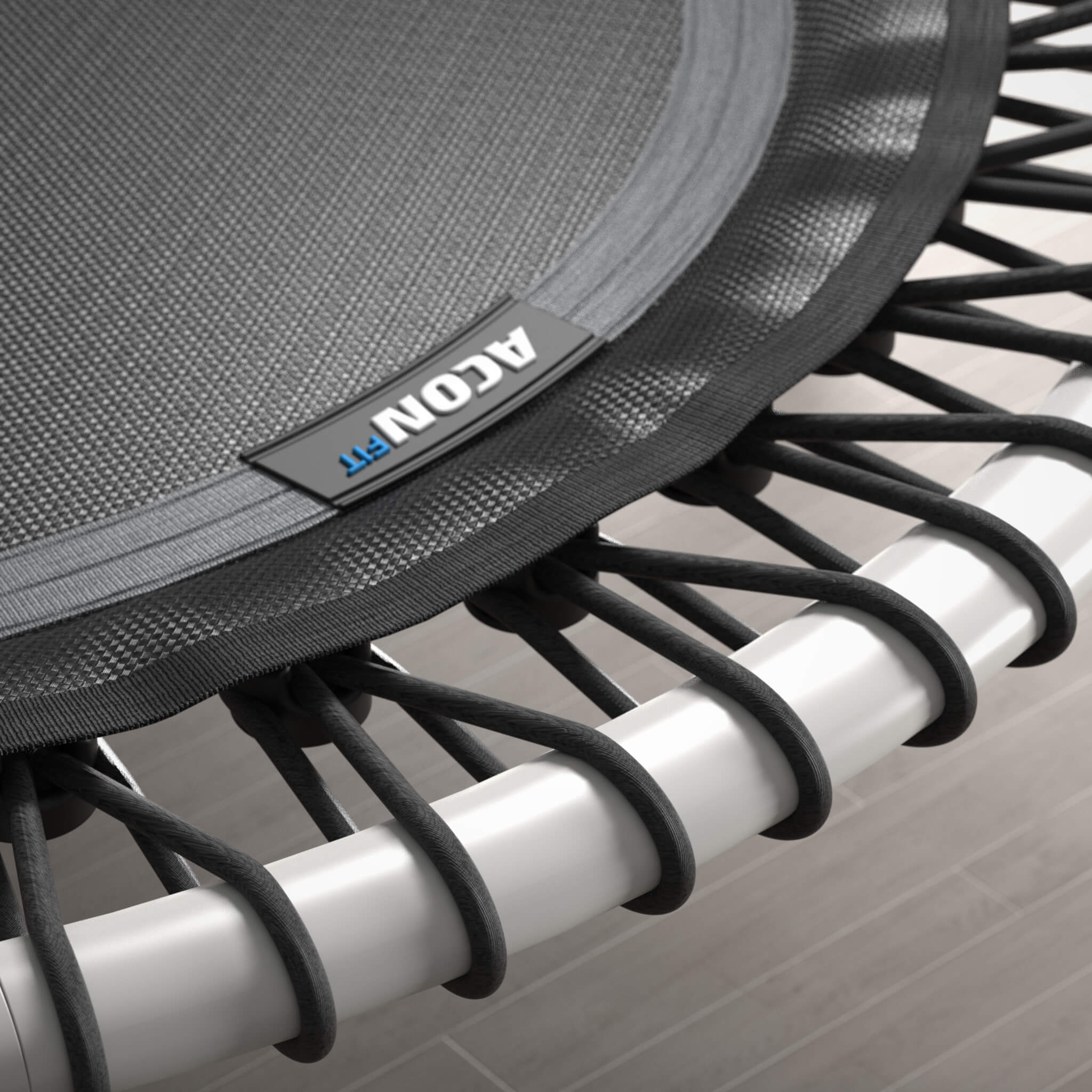 Close-up of the bungee cords of a white, round Acon FIT trampoline.