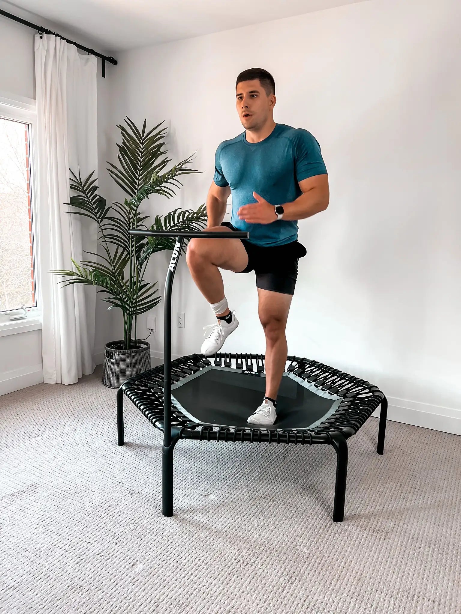 Alex, the second test subject, sprinting on a rebounder.