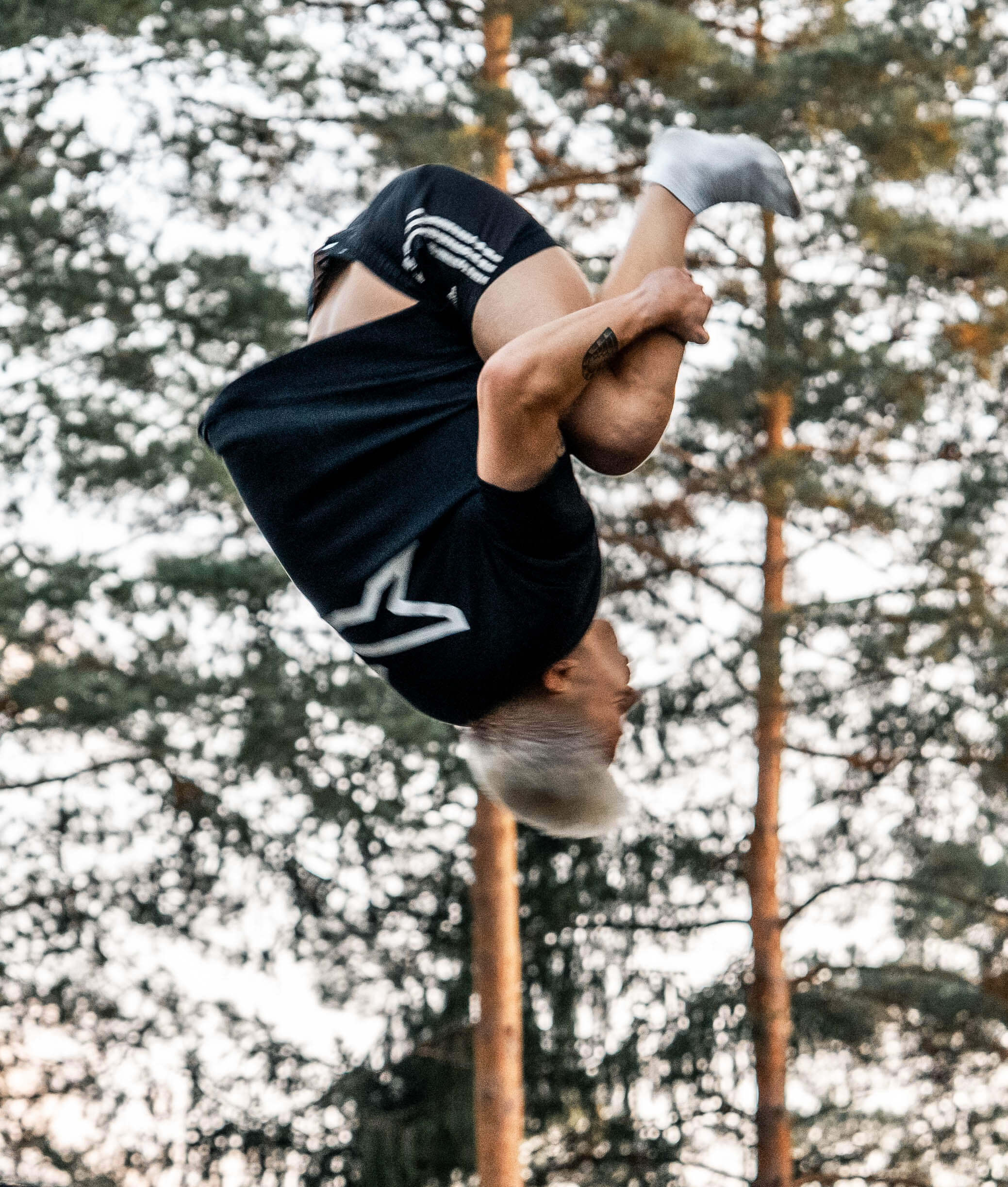 Trampoline tricker wearing Acon X t shirt.