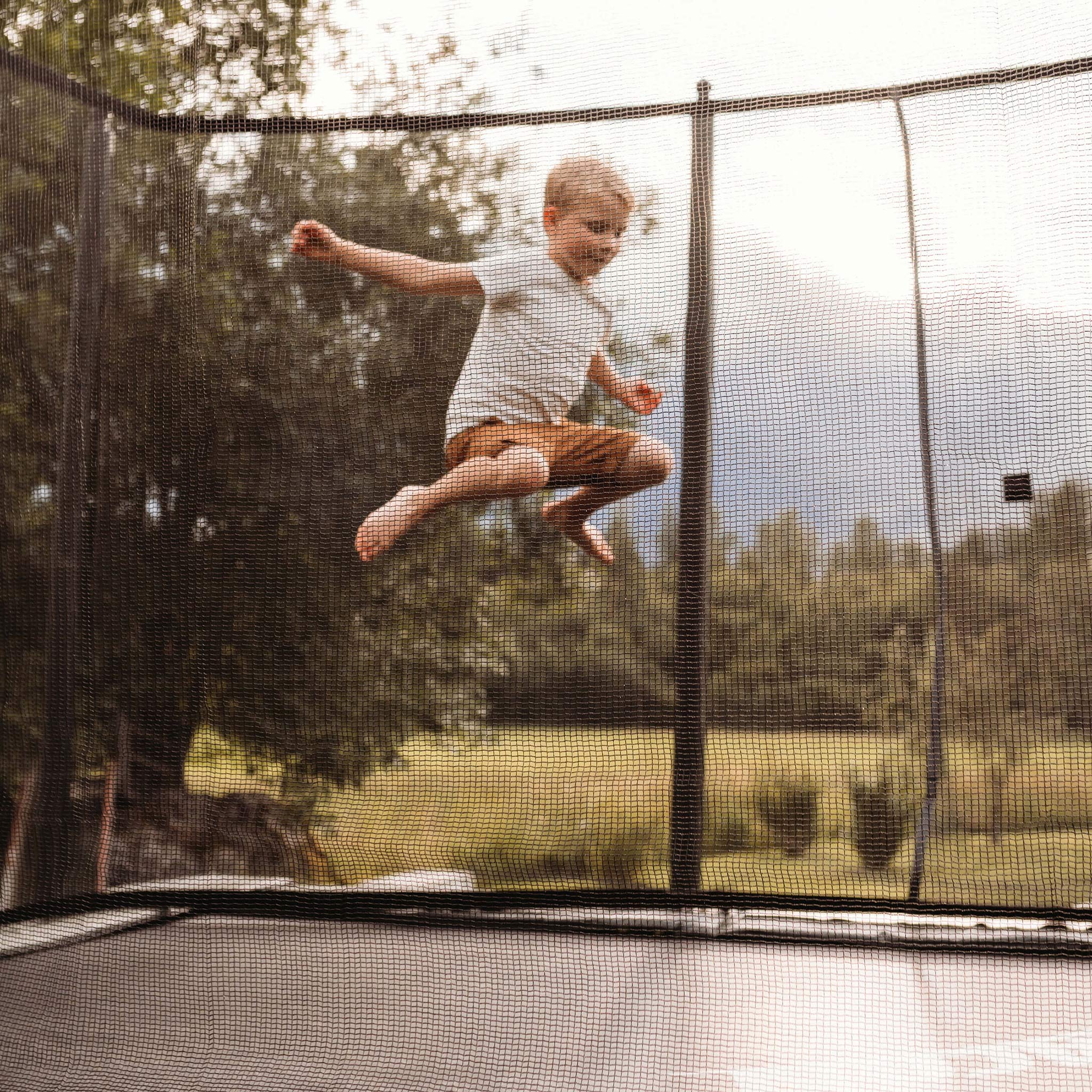 Boy jumping on a ACON Air 16 Sport trampoline.